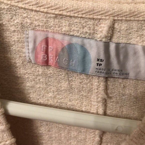 FREE PEOPLE BEACH SZ XS IVORY OVERSIZED RIBBED TIE FRONT LONG SLEEVE TOP - Picture 8 of 9